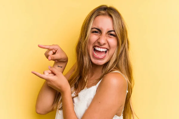 Young Caucasian Blonde Woman Isolated Yellow Background Excited Pointing Forefingers — Stock Photo, Image