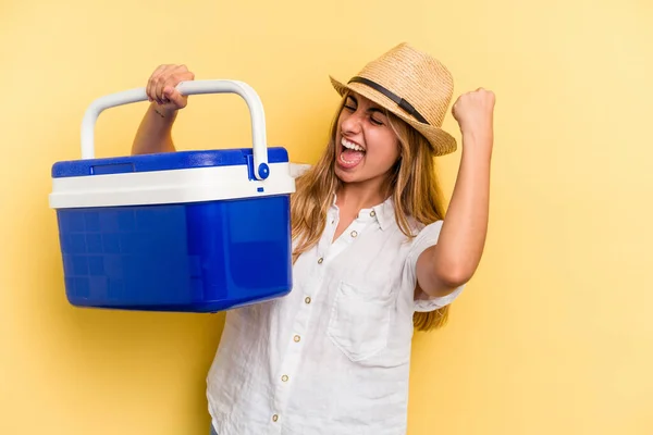 Young Caucasian Woman Holding Refrigerator Isolated Yellow Background Raising Fist — Stock Photo, Image