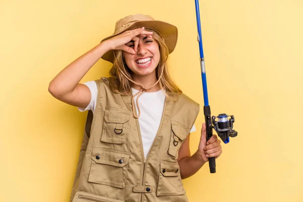 Young Caucasian Blonde Fisherwoman Holding Rod Isolated Yellow Background Excited — Stock Photo, Image