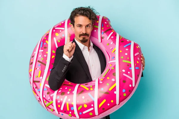 Young Business Man Inflatable Donut Isolated Blue Background Showing Number — 图库照片
