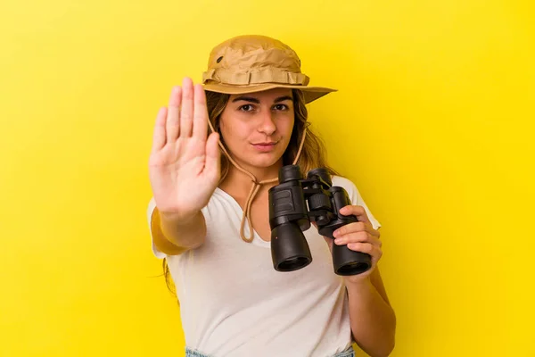 Young Caucasian Woman Holding Binoculars Isolated Yellow Background Standing Outstretched — Stock Photo, Image