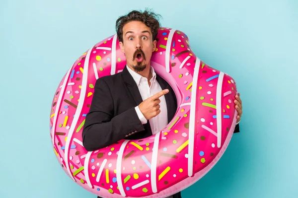 Young Business Man Inflatable Donut Isolated Blue Background Pointing Side — 图库照片
