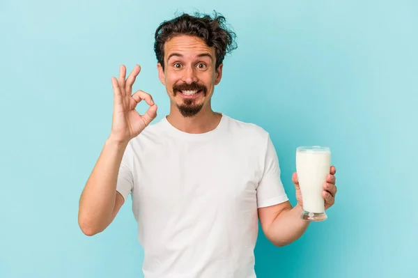 Young Caucasian Man Holding Glass Milk Isolated Blue Background Cheerful — 图库照片