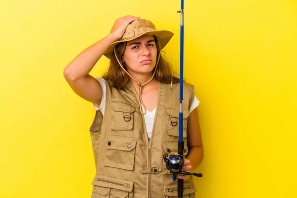 Young Caucasian Fisherwoman Holding Rod Isolated Yellow Background Being Shocked — Stock Photo, Image