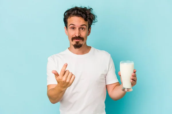 Young Caucasian Man Holding Glass Milk Isolated Blue Background Pointing — 图库照片