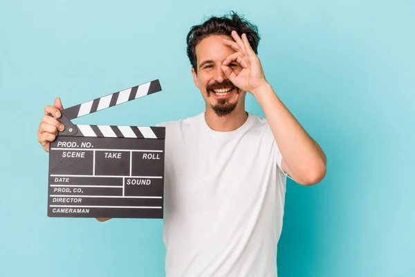 Young Caucasian Man Holding Clapperboard Isolated Blue Background Excited Keeping — Stock Photo, Image