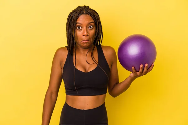 Young African American Woman Holding Pilates Ball Isolated Yellow Background — Stock Photo, Image