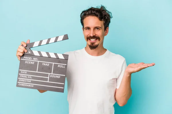 Young Caucasian Man Holding Clapperboard Isolated Blue Background Showing Copy — 图库照片