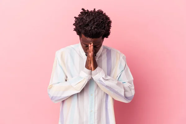 Young African American Man Isolated Pink Background Praying Showing Devotion — Stock Photo, Image