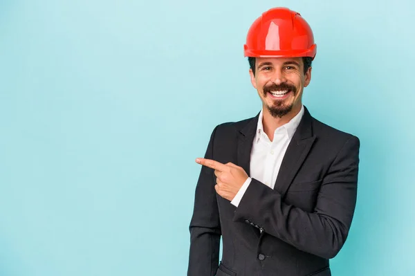 Young Architect Caucasian Man Isolated Blue Background Smiling Pointing Aside — Stockfoto