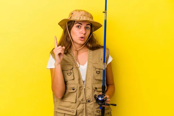 Young Caucasian Fisherwoman Holding Rod Isolated Yellow Background Having Some — Stock Photo, Image
