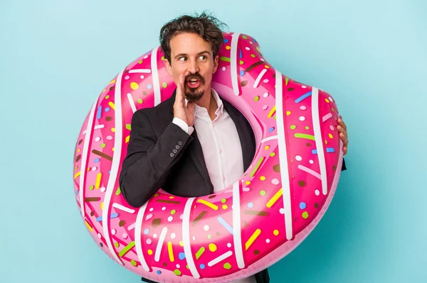 Young Business Man Inflatable Donut Isolated Blue Background Saying Secret — 图库照片