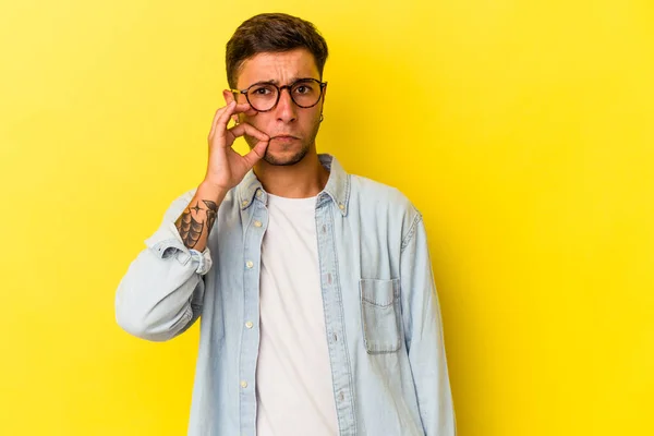 Young Caucasian Man Tattoos Isolated Yellow Background Fingers Lips Keeping — ストック写真