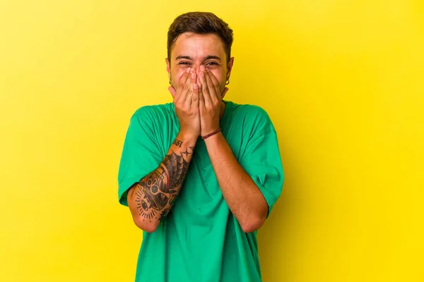 Young Caucasian Man Tattoos Isolated Yellow Background Laughing Something Covering —  Fotos de Stock