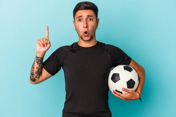 Young Man Playing Soccer Holding Ball Isolated Blue Background Having — 스톡 사진