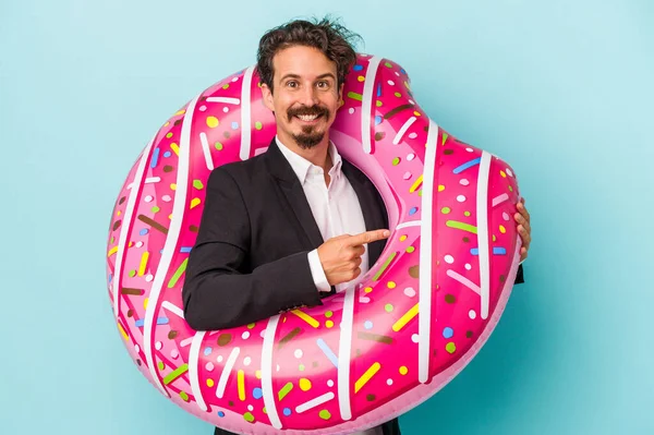 Young Business Man Inflatable Donut Isolated Blue Background Smiling Pointing — 图库照片