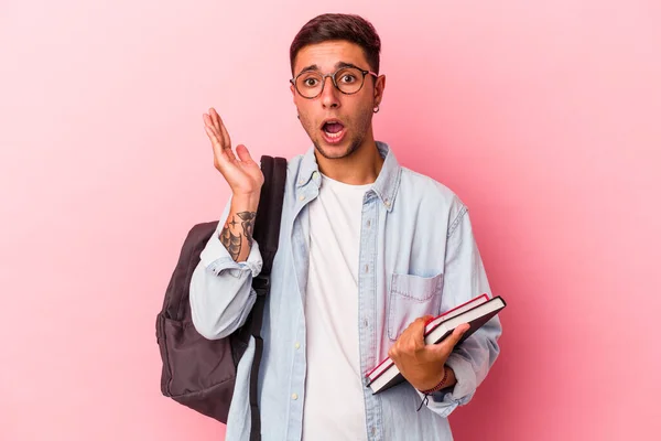 Young Caucasian Student Man Holding Books Isolated Pink Background Surprised — 스톡 사진