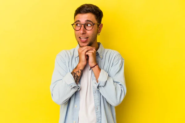Young Caucasian Man Tattoos Isolated Yellow Background Praying Luck Amazed — ストック写真