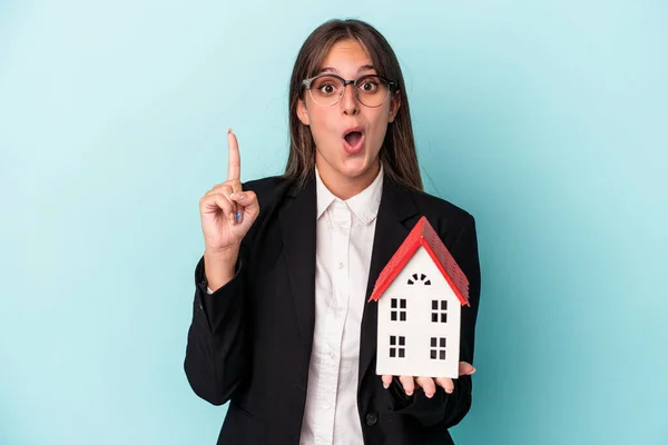 Young Business Woman Holding Toy Home Isolated Blue Background Having — 图库照片