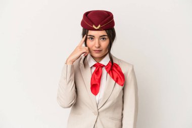 Young caucasian stewardess woman isolated on white background pointing temple with finger, thinking, focused on a task.