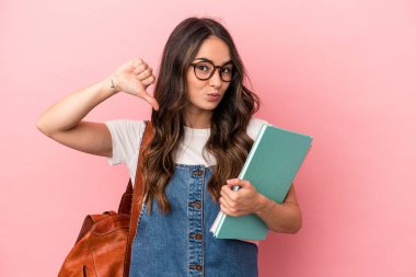 Young caucasian student woman isolated on pink background feels proud and self confident, example to follow.