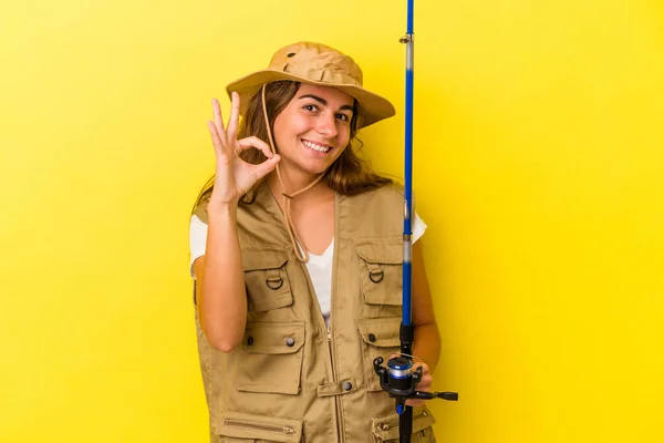 Young Caucasian Fisherwoman Holding Rod Isolated Yellow Background Cheerful Confident — Stock Photo, Image