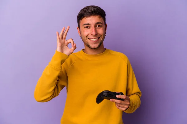 Young Caucasian Man Holding Game Controller Isolated Purple Background Cheerful —  Fotos de Stock