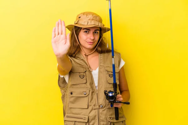 Young Caucasian Fisherwoman Holding Rod Isolated Yellow Background Standing Outstretched — Stock Photo, Image