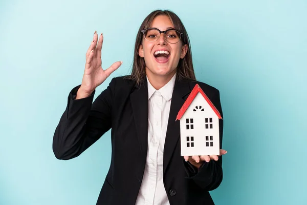 Young Business Woman Holding Toy Home Isolated Blue Background Receiving — 图库照片