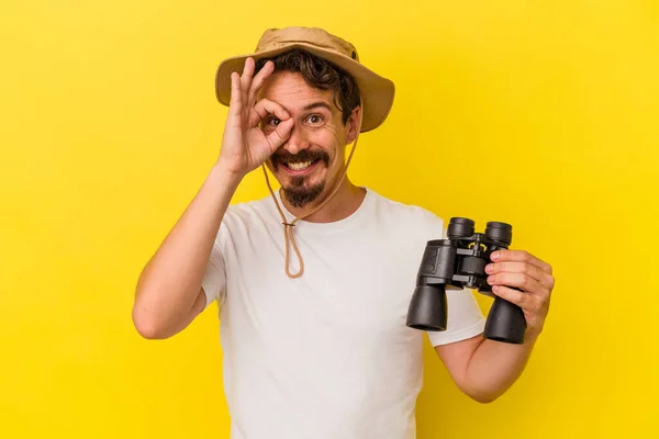 Young Caucasian Man Holding Binoculars Isolated Yellow Background Excited Keeping — 图库照片