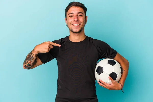 Young Man Playing Soccer Holding Ball Isolated Blue Background Person — Photo