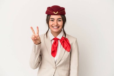 Young caucasian stewardess woman isolated on white background showing number two with fingers.