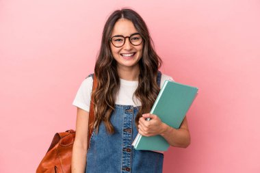 Young caucasian student woman isolated on pink background happy, smiling and cheerful.