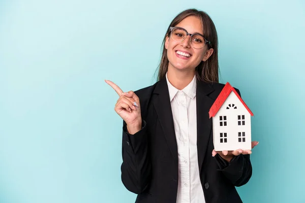 Young Business Woman Holding Toy Home Isolated Blue Background Smiling — Stock Photo, Image