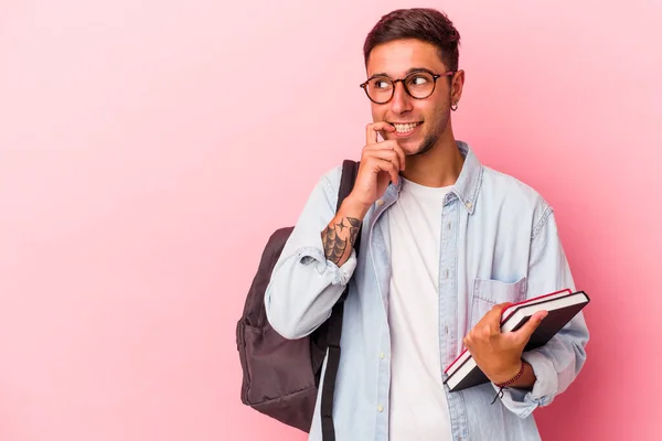 Young Caucasian Student Man Holding Books Isolated Pink Background Relaxed — 스톡 사진