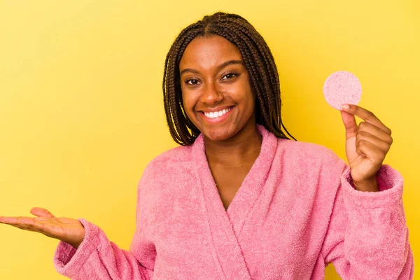 Young African American Woman Wearing Bathrobe Holding Make Disk Isolated — 图库照片