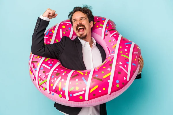 Young Business Man Inflatable Donut Isolated Blue Background Raising Fist — 图库照片