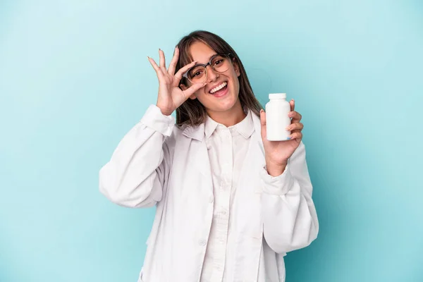 Young Pharmacist Woman Holding Pills Isolated Blue Background Excited Keeping — Stockfoto