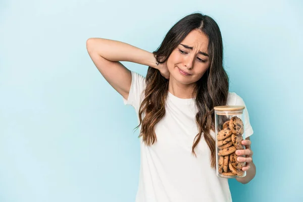 Young caucasian woman making a move isolated on yellow background touching back of head, thinking and making a choice.