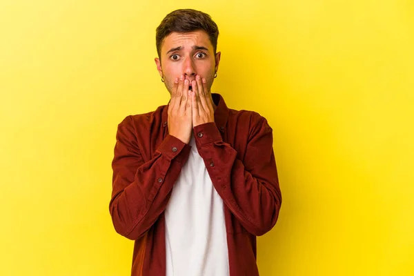 Young Caucasian Man Tattoos Isolated Yellow Background Shocked Covering Mouth —  Fotos de Stock