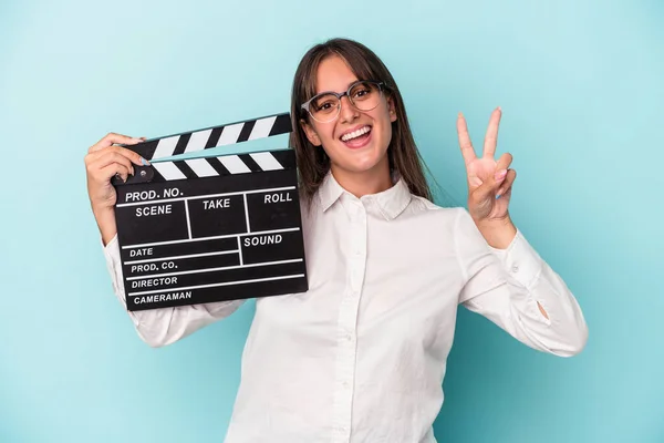 Young Caucasian Woman Holding Clapperboard Isolated Blue Background Showing Number — 图库照片