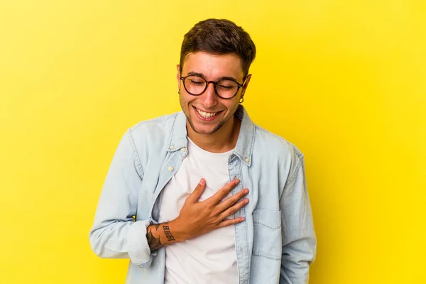 Young Caucasian Man Tattoos Isolated Yellow Background Laughs Out Loudly — 스톡 사진