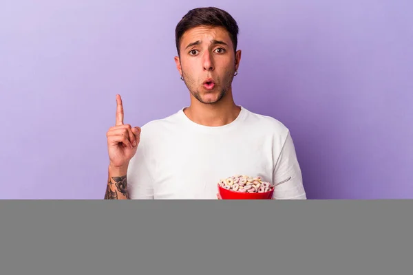 Young Caucasian Man Eating Cereals Isolated Purple Background Having Some — Stock Photo, Image