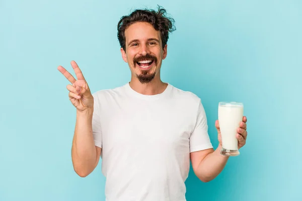 Young Caucasian Man Holding Glass Milk Isolated Blue Background Joyful — Fotografia de Stock