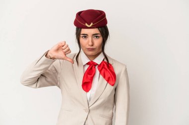 Young caucasian stewardess woman isolated on white background showing a dislike gesture, thumbs down. Disagreement concept.