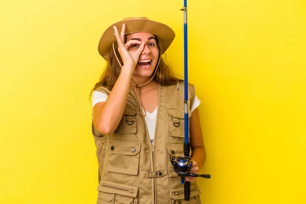 Young Caucasian Fisherwoman Holding Rod Isolated Yellow Background Excited Keeping — Stock Photo, Image