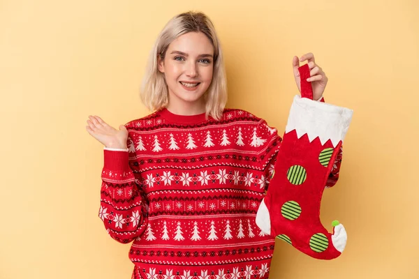 Young Caucasian Woman Holding Elf Sock Isolated Yellow Background Showing — Stock Photo, Image