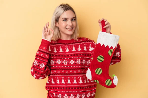 Young Caucasian Woman Holding Elf Sock Isolated Yellow Background Cheerful — Stock Photo, Image