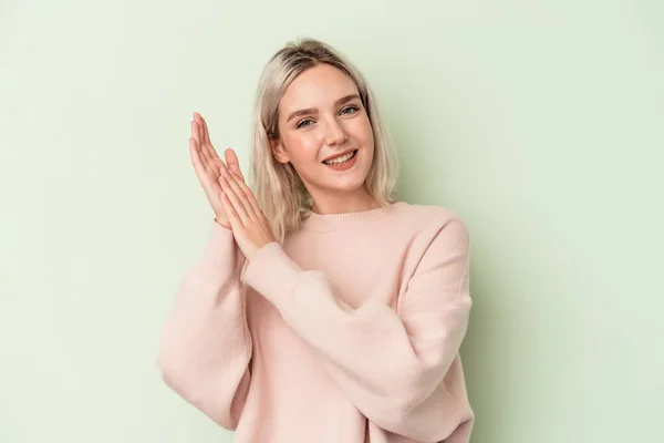 Young Caucasian Woman Isolated Green Background Feeling Energetic Comfortable Rubbing — Φωτογραφία Αρχείου