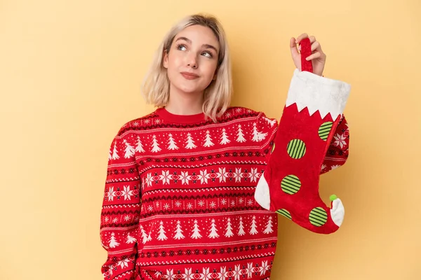 Young Caucasian Woman Holding Elf Sock Isolated Yellow Background Dreaming — Stock Photo, Image